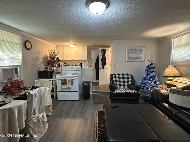 kitchen featuring dark wood-type flooring, white electric stove, cooling unit, a textured ceiling, and white cabinets