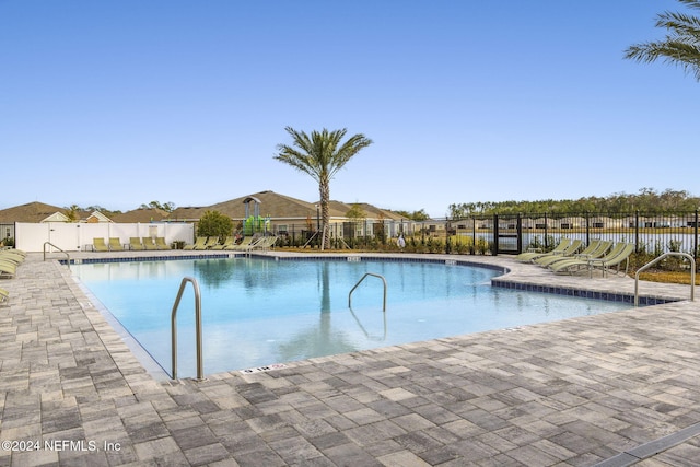 view of pool featuring a patio