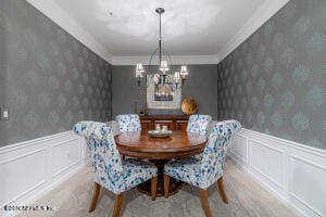 dining room featuring crown molding and hardwood / wood-style flooring