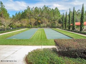 surrounding community featuring a lawn