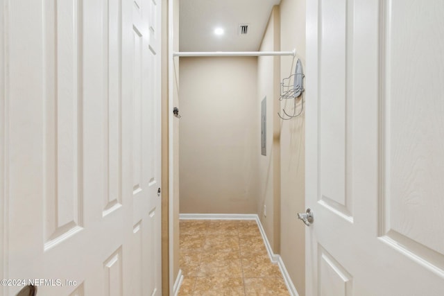 hall featuring light tile patterned floors