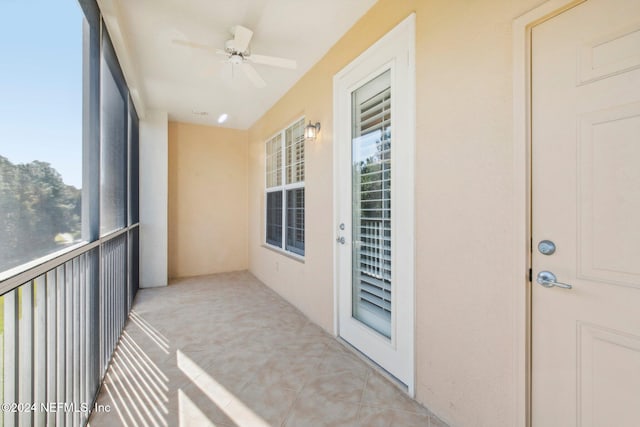 sunroom / solarium featuring ceiling fan