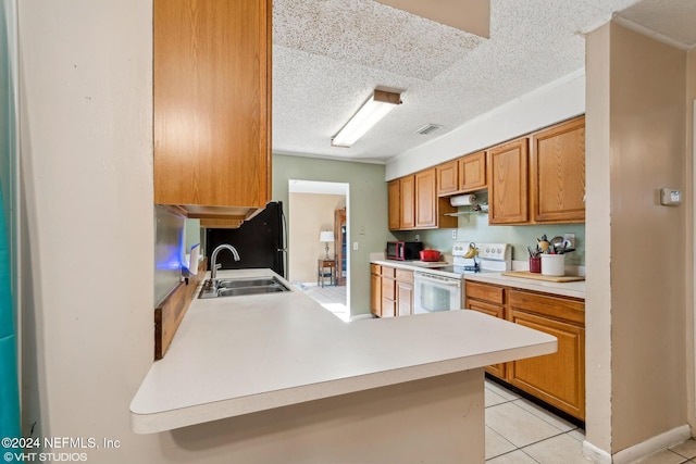 kitchen with kitchen peninsula, a textured ceiling, sink, black appliances, and light tile patterned floors