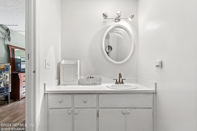 bathroom featuring vanity and wood-type flooring