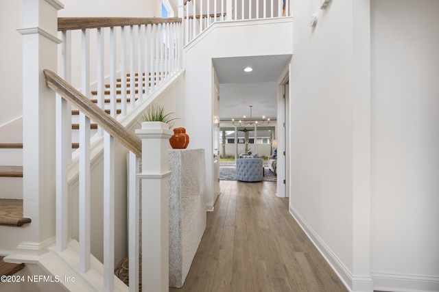 stairs with hardwood / wood-style flooring