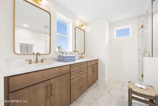 bathroom featuring plenty of natural light, an enclosed shower, and vanity