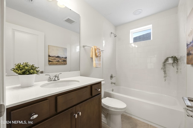 full bathroom featuring tile patterned flooring, vanity, toilet, and tiled shower / bath combo