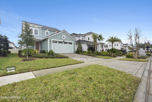 view of front facade featuring a front yard and a garage