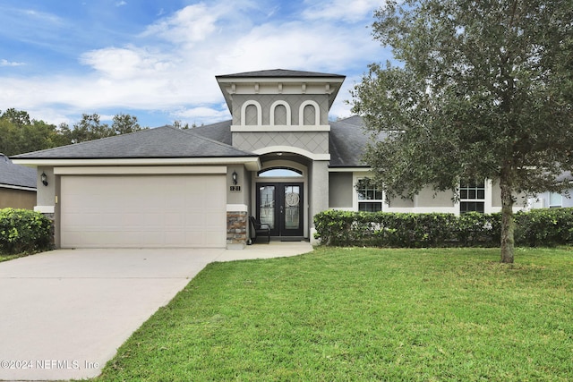 view of front of property featuring french doors and a front lawn