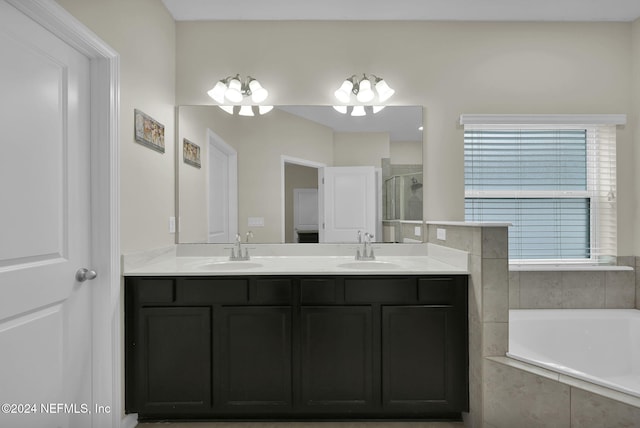 bathroom with plus walk in shower and vanity