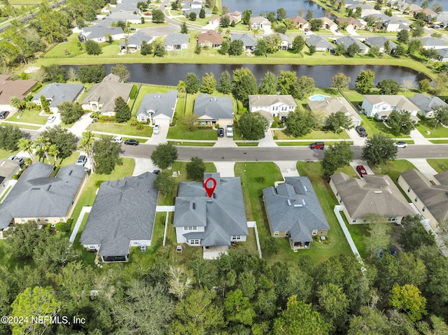 drone / aerial view with a water view