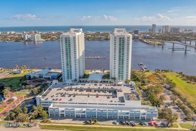 birds eye view of property with a water view