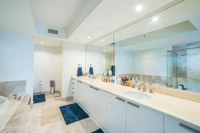 231 Riverside Dr Unit 1203-1, Daytona Beach, FL 32117 - full bath featuring recessed lighting, a garden tub, double vanity, a shower with door, and tile patterned flooring