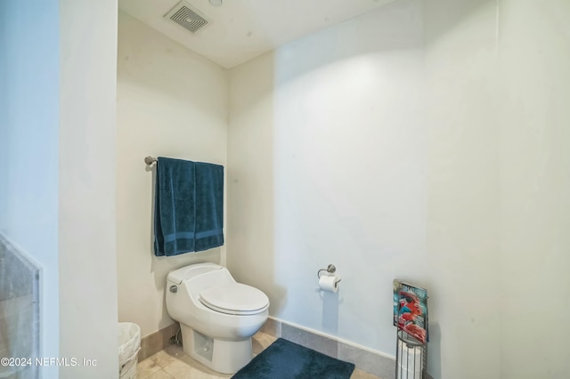 231 Riverside Dr Unit 1203-1, Daytona Beach, FL 32117 - bathroom featuring toilet and tile patterned flooring