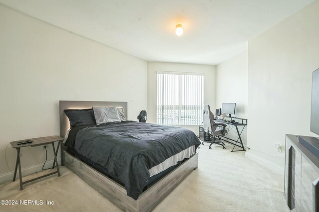 231 Riverside Dr Unit 1203-1, Daytona Beach, FL 32117 - carpeted bedroom with baseboards and an office area