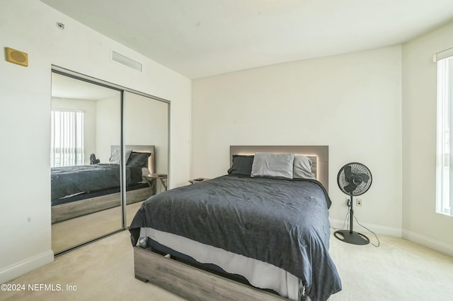 231 Riverside Dr Unit 1203-1, Daytona Beach, FL 32117 - carpeted bedroom featuring baseboards and a closet