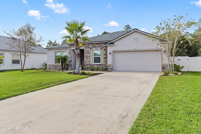 view of front of property with a garage and a front lawn