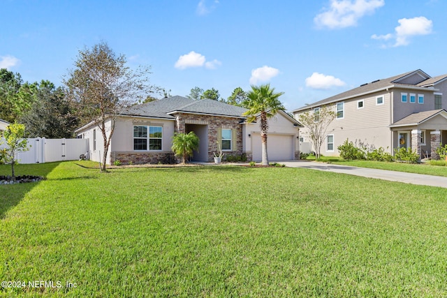 view of front of house with a front lawn and a garage