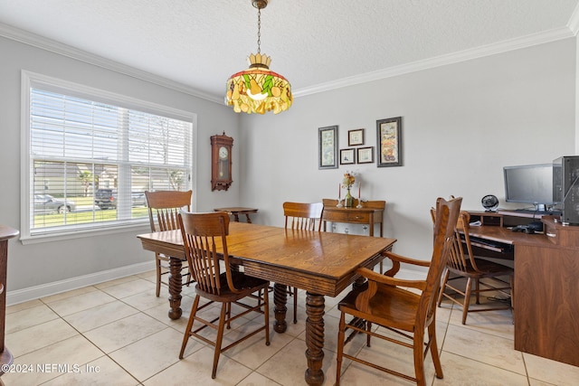 tiled dining room with a textured ceiling and ornamental molding