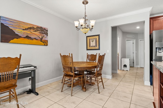 dining room with crown molding, a notable chandelier, and light tile patterned flooring