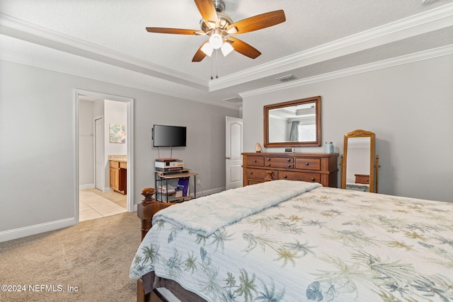 bedroom featuring light carpet, ensuite bathroom, crown molding, ceiling fan, and a textured ceiling