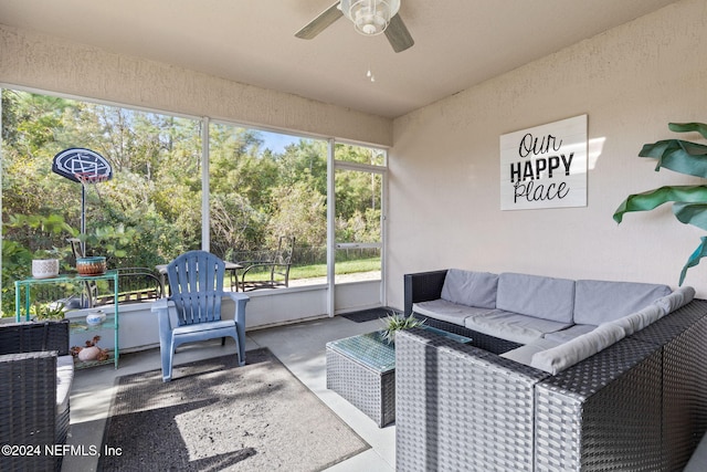 sunroom / solarium featuring ceiling fan