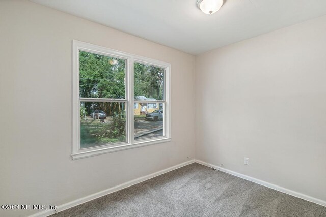 928 Brandywine St, Jacksonville, FL 32208 - carpeted empty room featuring baseboards