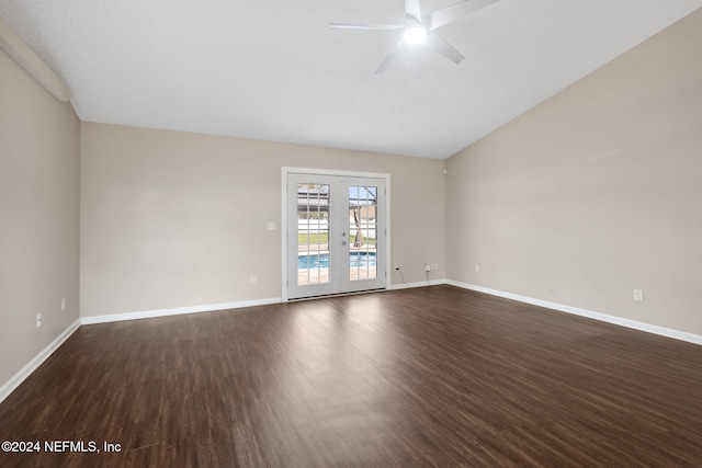 unfurnished room with lofted ceiling, french doors, dark hardwood / wood-style floors, ceiling fan, and a textured ceiling