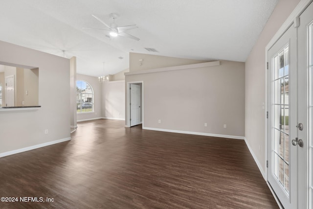 unfurnished room featuring ceiling fan with notable chandelier, a textured ceiling, dark hardwood / wood-style flooring, and vaulted ceiling