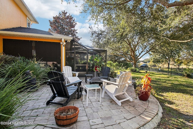 3370 Turkey Creek Dr, Green Cove Springs, FL 32043 - view of patio / terrace with a fire pit, glass enclosure, and a sunroom