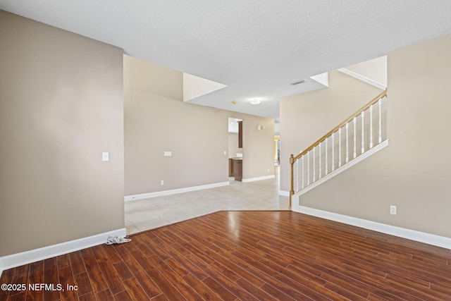 empty room featuring a textured ceiling