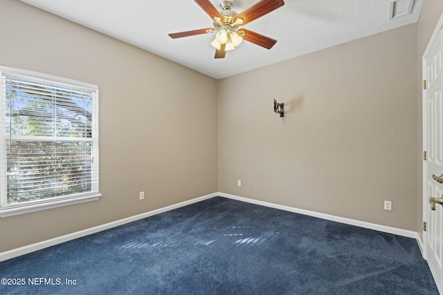 carpeted empty room with ceiling fan