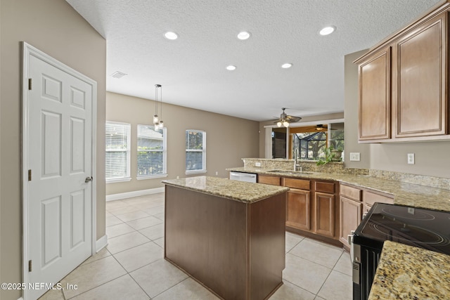 kitchen featuring dishwasher, sink, range with electric cooktop, ceiling fan, and light tile patterned floors