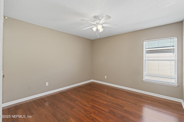 empty room with hardwood / wood-style flooring, a textured ceiling, and ceiling fan