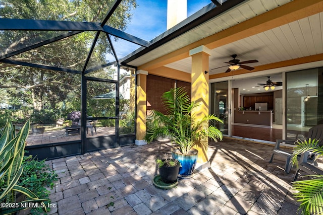 view of patio / terrace with glass enclosure and ceiling fan