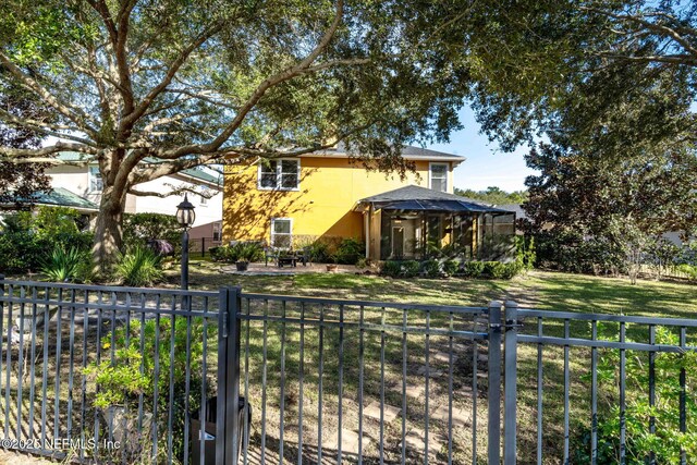 view of front facade with a gazebo and a front lawn