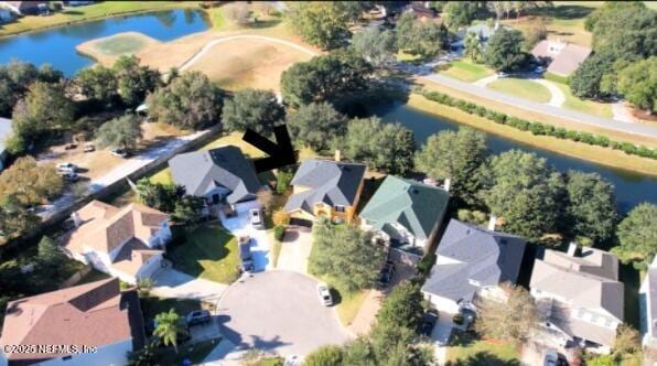 birds eye view of property with a water view