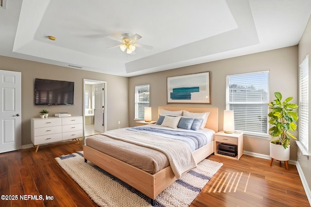 3370 Turkey Creek Dr, Green Cove Springs, FL 32043 - bedroom featuring a raised ceiling, wood finished floors, and multiple windows