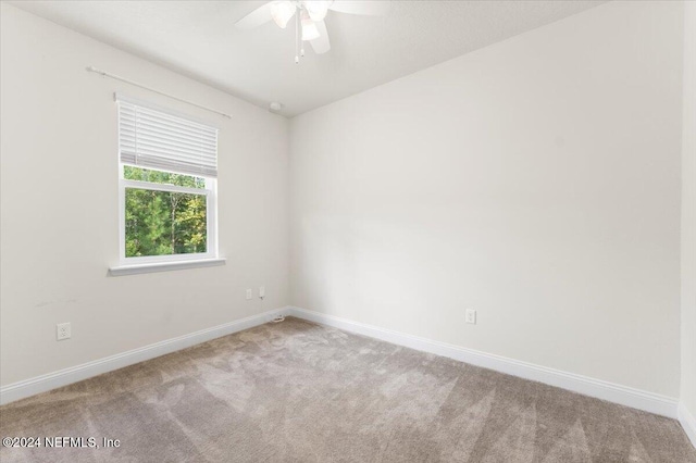 carpeted empty room with ceiling fan