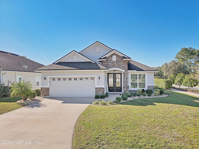 view of front of house featuring french doors, a garage, and a front lawn