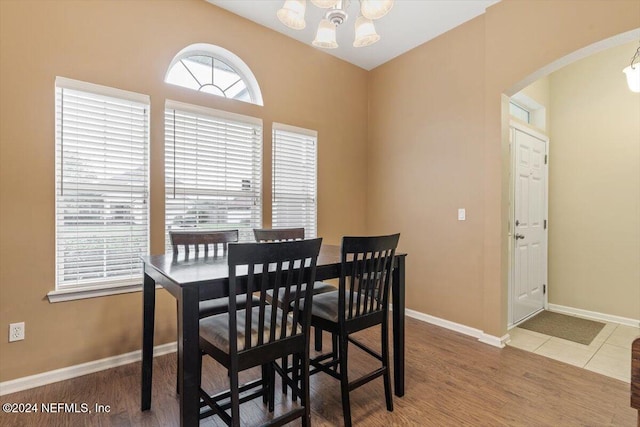 dining area featuring a chandelier and hardwood / wood-style floors