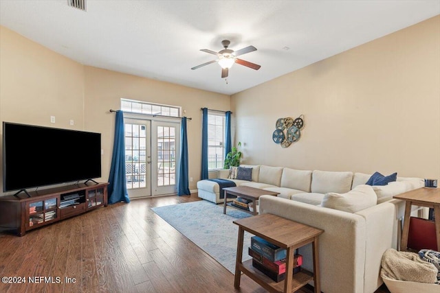 living room with hardwood / wood-style flooring, ceiling fan, and french doors