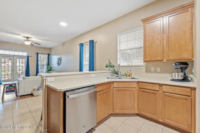 kitchen with kitchen peninsula, sink, stainless steel dishwasher, and plenty of natural light