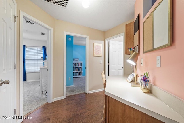 corridor with dark hardwood / wood-style floors