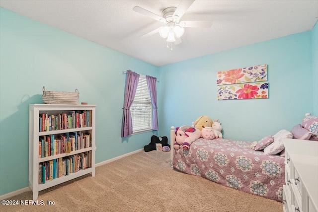 bedroom with ceiling fan and light colored carpet