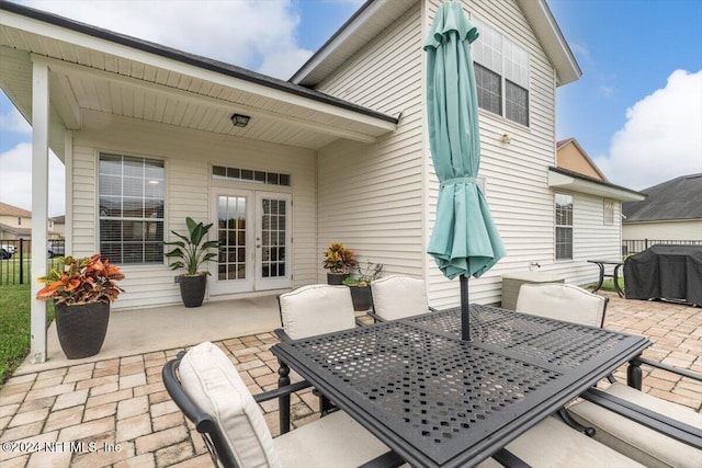 view of patio / terrace featuring grilling area and french doors