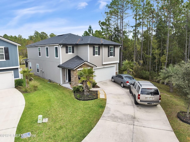 view of front facade with a front lawn and a garage