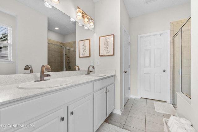 bathroom with tile patterned flooring and vanity