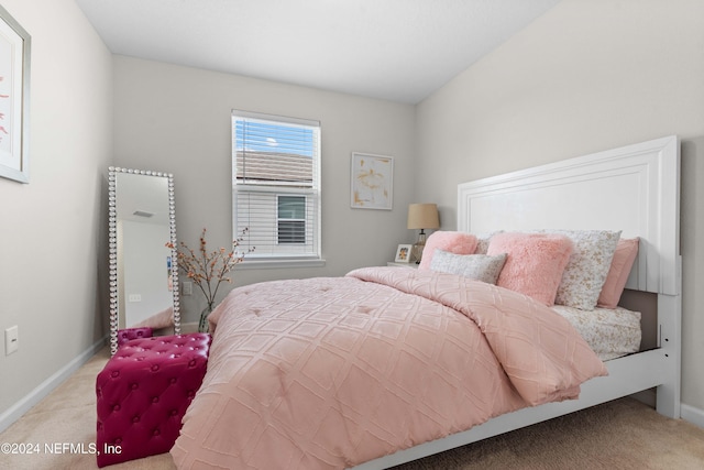 bedroom featuring light colored carpet