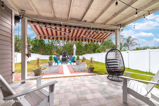 view of patio with a fire pit